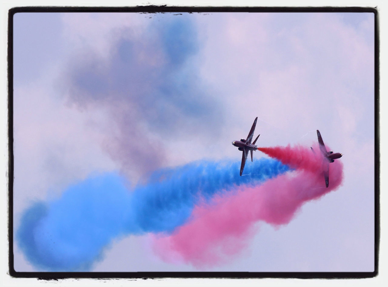 sky, cloud - sky, low angle view, transfer print, flying, auto post production filter, cloudy, airplane, cloud, air vehicle, transportation, mid-air, blue, mode of transport, outdoors, day, no people, nature, on the move, wind