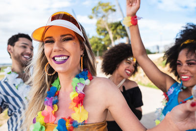 Portrait of smiling friends enjoying party