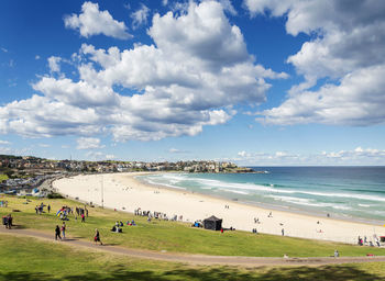 High angle view of people at beach against sky