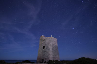 Low angle view of historical building against sky at night