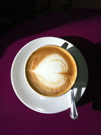 High angle view of cappuccino on table