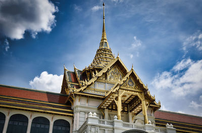 Low angle view of temple building against cloudy sky