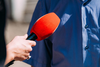 News reporters interviewing an important person outdoors