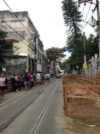 Empty road along buildings