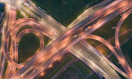 High angle view of light trails on road at night