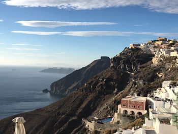 Panoramic view of sea and buildings against sky