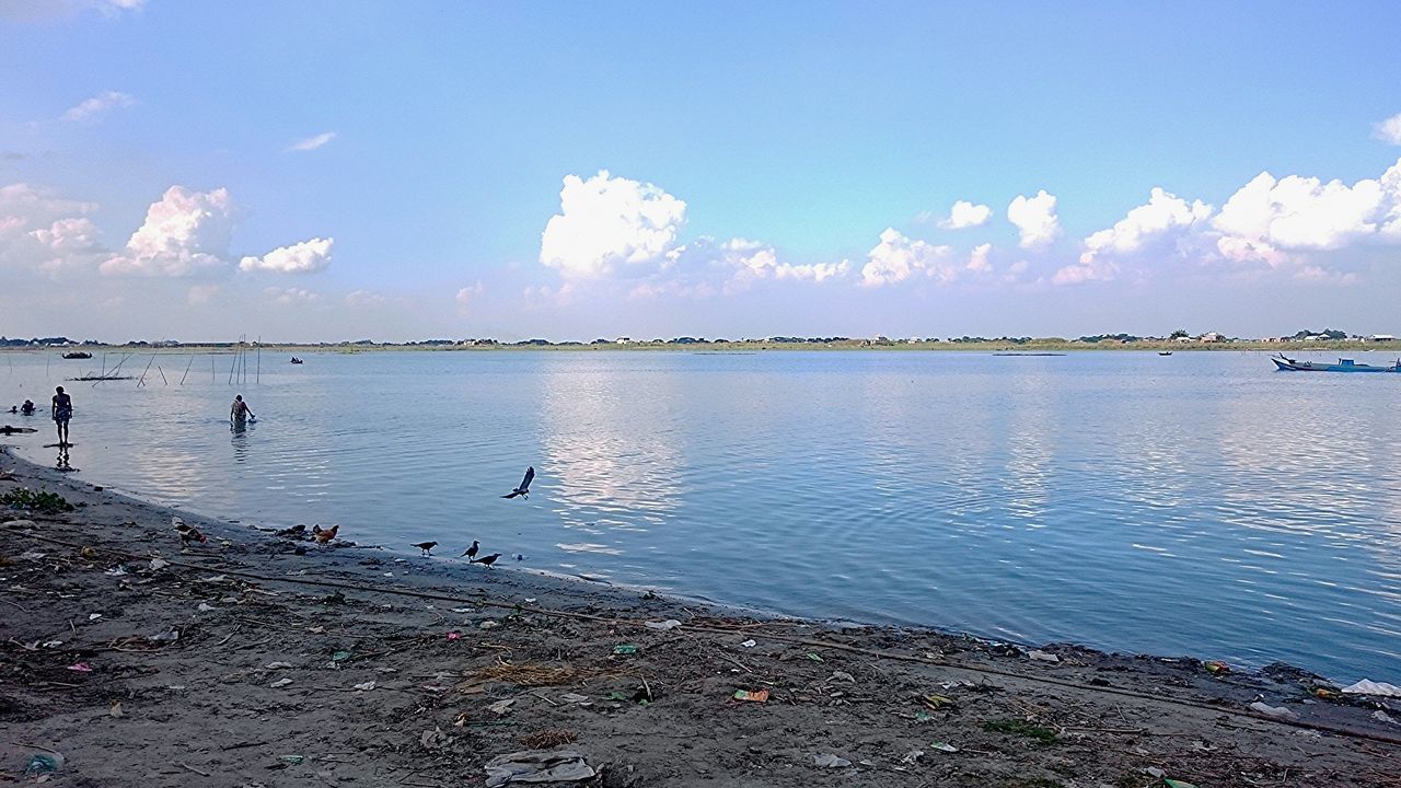 water, sky, bird, tranquil scene, animal themes, tranquility, scenics, cloud - sky, beauty in nature, lake, nature, blue, reflection, animals in the wild, cloud, wildlife, sea, day, flock of birds