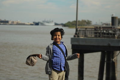 Portrait of boy standing at beach