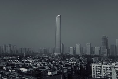 Modern buildings in city against clear sky