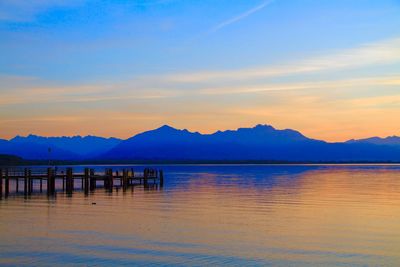 Scenic view of lake against sky during sunset