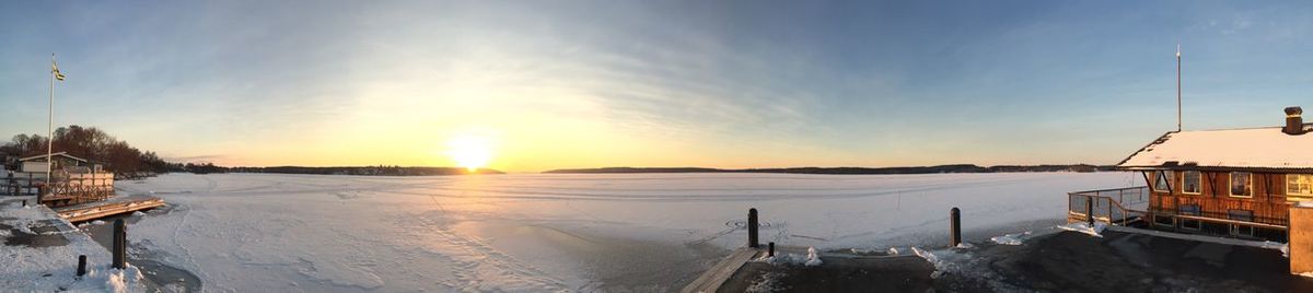 Panoramic view of buildings against sky during winter