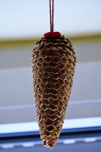 Close-up of decoration hanging on metal