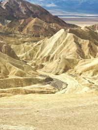 Scenic view of arid landscape against sky