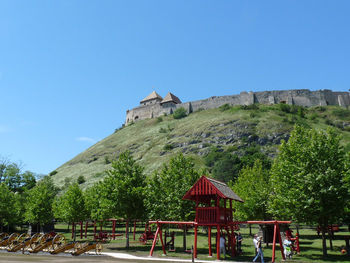 Built structure in park against clear blue sky