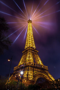 Low angle view of illuminated temple against sky at night