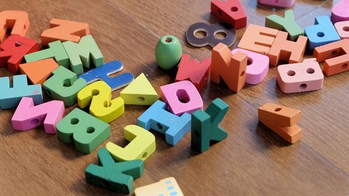 High angle view of colorful alphabets on table