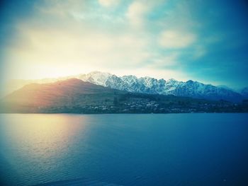 Scenic view of mountains against cloudy sky
