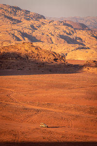 Scenic view of desert against mountain