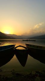 Scenic view of lake against sky during sunset