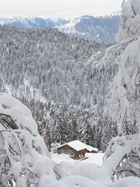 Snow covered landscape against mountain range
