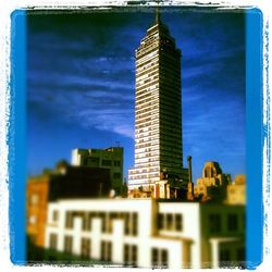 Low angle view of buildings against blue sky