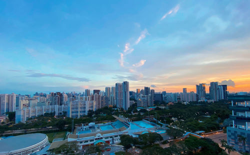 High angle view of buildings against sky during sunset