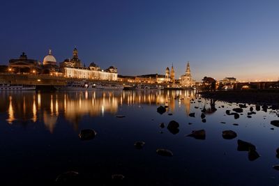 Reflection of illuminated buildings in water