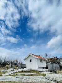 House on field against sky