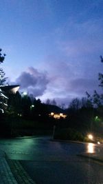 View of illuminated street lights at night