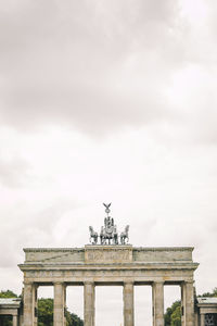 Low angle view of brandenburg gate against sky in city