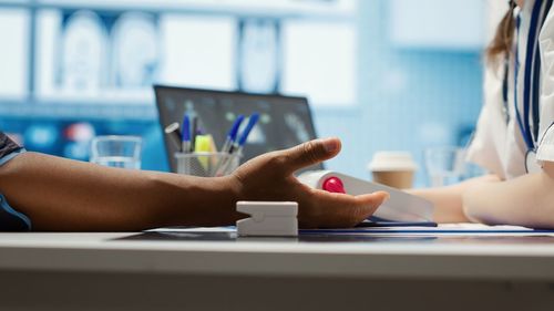 Midsection of woman using laptop