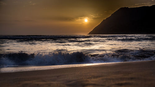 Scenic view of sea against sky during sunset