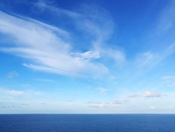Scenic view of sea against blue sky