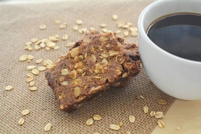 Close-up of food with coffee cup on burlap