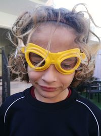 Close-up of boy wearing novelty glass