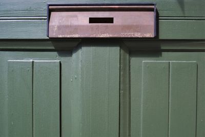 Close-up of mailbox on wall