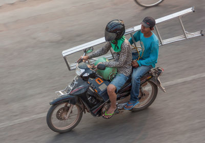 Man riding bicycle on street