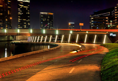 Light trails on road in city at night