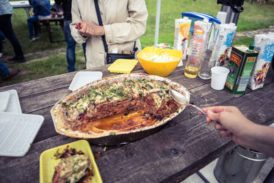 Midsection of people eating food