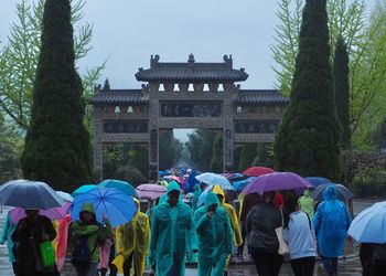 Tourists in china in a rainy day