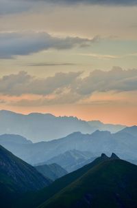 Scenic view of mountains against sky during sunset
