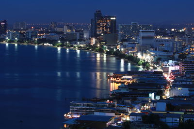 High angle view of illuminated buildings in city at night