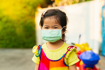 Portrait of boy standing outdoors