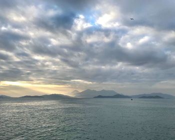 Scenic view of sea against sky at sunset
