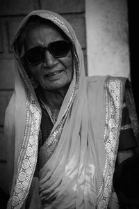 Portrait of senior woman in sari wearing sunglasses