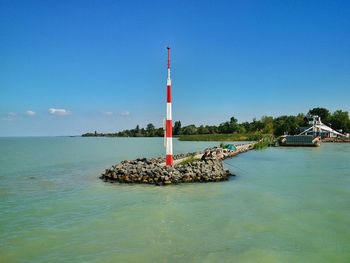 Scenic view of sea against clear blue sky