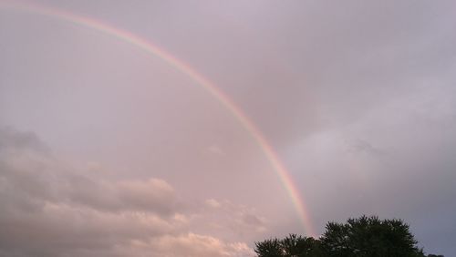 Low angle view of rainbow in sky