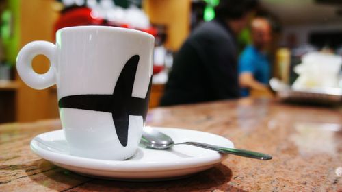 Close-up of coffee cup on table