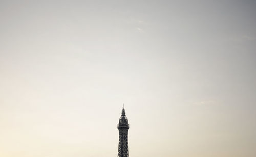 High section of tower against sky