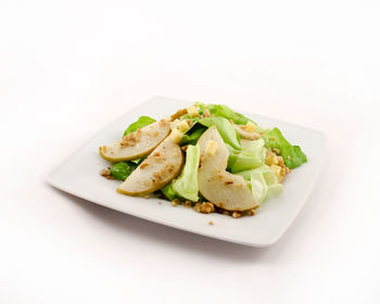 High angle view of salad in plate against white background